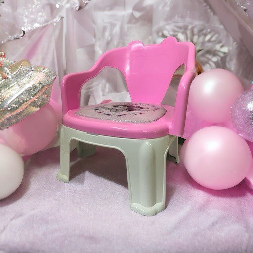 kids chair placed with pink balloons